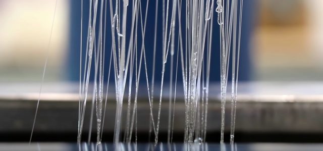 Spinning of cellulose solution to make fibres